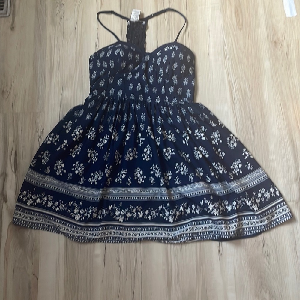 American Rag, Navy blue flower dress size M. Warned couple of times.